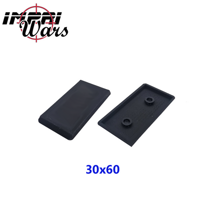 Peana negra de caballería de 30x60 mm vista por arriba y por abajo, con anclajes centrales.