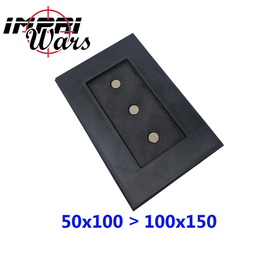Adaptador imantado negro de 50x100 a 100x150 mm con tres placas metálicas visibles.