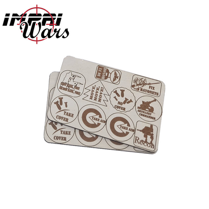 Dos planchas de tokens de la Guardia Imperial con marcadores redondos y de otras formas grabados.