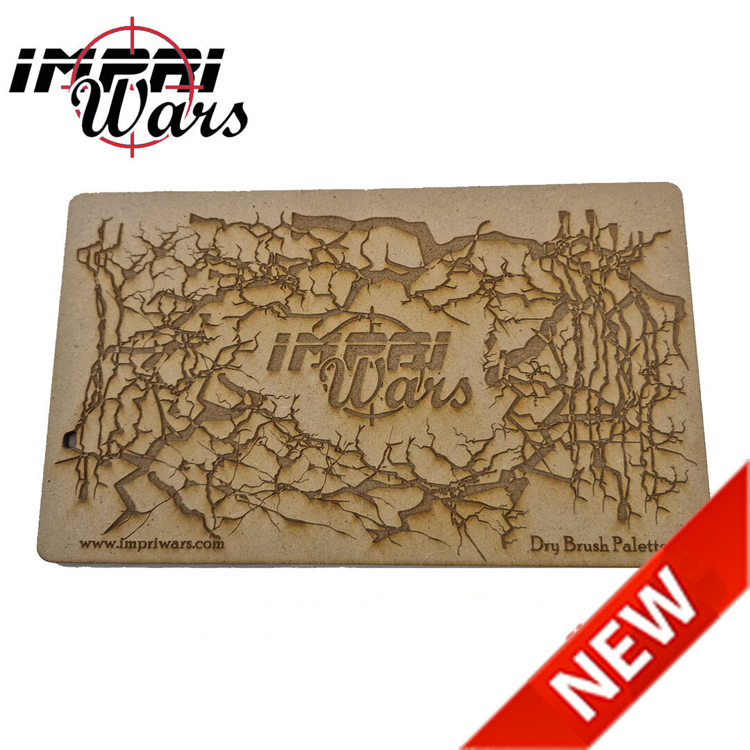 Paleta rectangular de DM para pincel seco con superficie decorada con ramas grabadas.