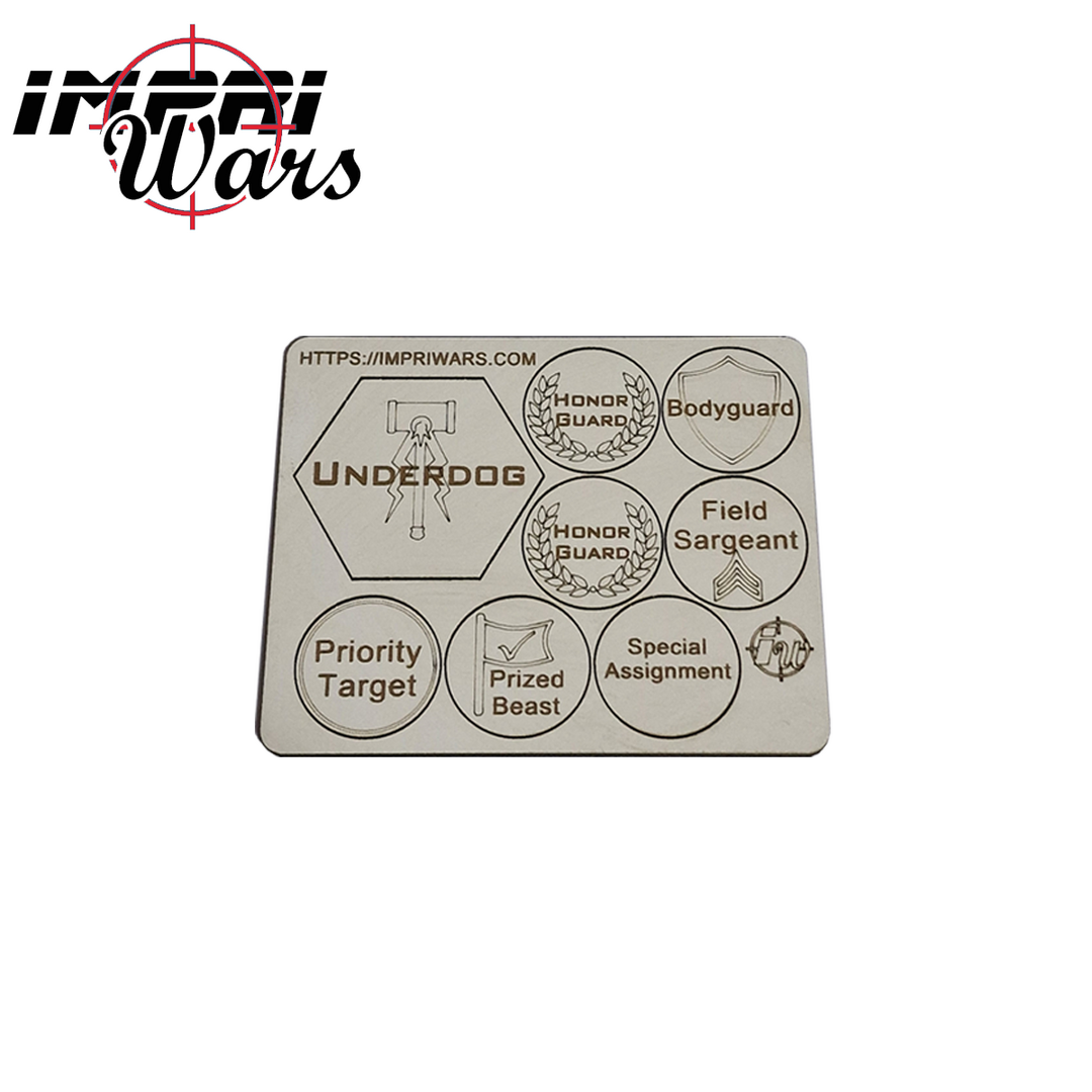 Plancha de tokens de DM con marcadores de objetivos y asignaciones grabados.